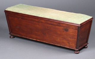 A 19th/20th Century pine sarcophagus shaped ottoman with hinged lid, raised on bun feet 37cm h x 109cm w x 34cm d 