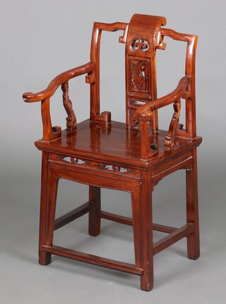 A Chinese hardwood slat back throne chair, the slat carved a figure of a standing Yuang Li, having a pierced and carved apron 88cm h x 54cm w x 40cm d (seat 26cm x 24cm) 