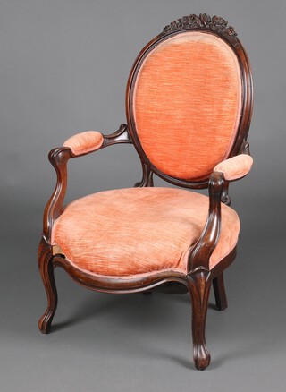 A Victorian caved mahogany show frame open armchair, upholstered in pink material,  97cm h x 62cm w x 54cm d 
