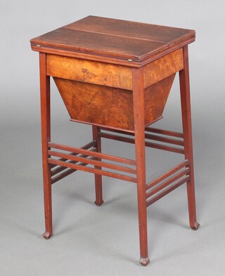 An Edwardian rectangular mahogany work/sewing table with hinged lid, the base fitted a deep basket, raised on outswept supports ending in spade feet 71cm h x 34cm w x 42cm d 