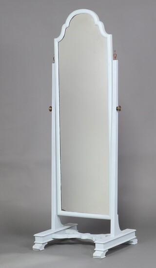 An arched plate cheval mirror contained in an ebonised frame 