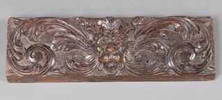 A Victorian deeply carved oak drawer front decorated a lion 14cm h x 48cm w x 3cm d 