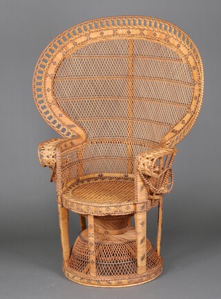 A 1960's woven cane peacock chair 136cm h x 73cm w 