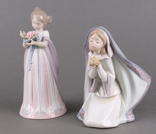 A Lladro figure of a kneeling lady 5792 18cm, a ditto of a young girl holding a bouquet 8151 20cm