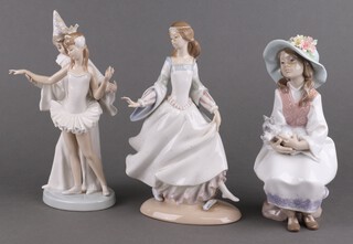 Three Lladro figures - seated girl with a dog 6400 22cm, a lady 23cm and a group of a clown and a ballerina 20cm  