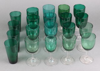 Sixteen Victorian green glass sherry glasses in mixed sizes and 4 green beakers