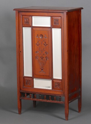 An Edwardian carved walnut music cabinet enclosed by carved and mirrored panelled doors with a 3/4 gallery (unattached and in several pieces) 101cm h x 56cm w x 35cm d 