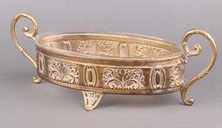 An Art Nouveau repousse gilt brass and glass dish holder with scroll handles 42cm 