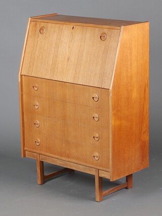A mid-Century teak bureau, the fall front revealing a fitted interior above 4 drawers with counter sunk handles 106cm h x 76cm w x 36cm d (sun bleached, ring and contact marks in places, small section of veneer missing to left edge of fall front) 