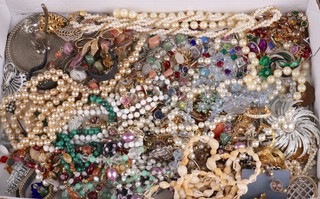 A quantity of vintage costume jewellery and watches