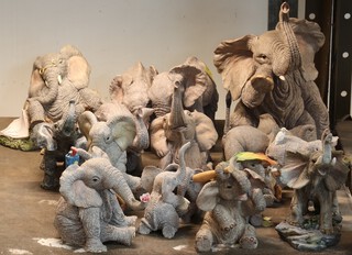A collection of composition Tuskers figures of elephants 