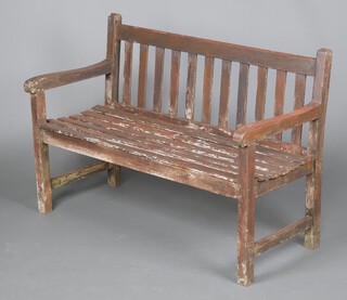 A rectangular hardwood garden bench 84cm h x 122cm w x 55cm d 