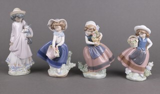 A Lladro figure of a girl holding a basket of flowers 17cm, ditto 5221 16cm, another holding a vase 5223 16cm and girl holding a kitten 5549 18cm 