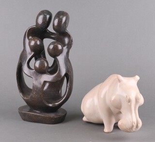 A Zimbabwe carved hardstone figure of a seated hippopotamus 15cm, ditto of a group of 5 people 30cm 