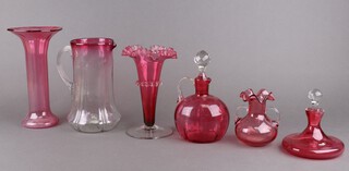 A Victorian cranberry glass vase 26cm, 1 other, a jug, 2 decanters and a vase 