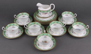 An Aynsley floral tea set with green rims B571 comprising 7 tea cups (1 a/f), 8 saucers and a milk jug 