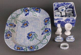 A floral decorated meat plate 40cm, a collection of porcelain napkin rings and a bowl