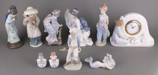 A collection of Lladro figures -  young girl in dungarees 7650 26cm (for the Collectors Society 1997), Japanese lady looking in a mirror 6748 25cm (flowers detached), 2 Christmas tree decorations of kings, a Lladro timepiece 3777 19cm, a reclining mermaid 12cm, a boy sailor 22cm, Japanese lady wearing a broad hat 26cm, Japanese lady with flowers 23cm and a Japanese lady 25cm 