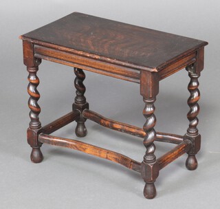 A 1930's rectangular oak stool, raised on spiral turned supports 39cm h x 45cm w x 25cm d  