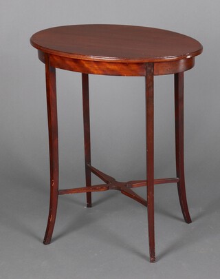 An oval mahogany occasional table raised on outswept supports with X framed stretcher 70cm h x 59cm w x 40cm d 