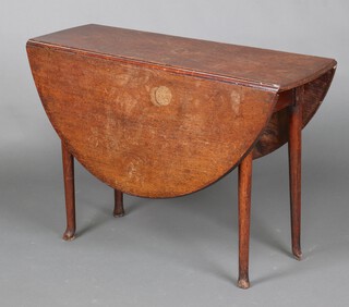 A 19th Century oak oval drop flap tea table, raised on club supports 69cm h x 133cm (water and contact marks in places, all feet have been reduced) 