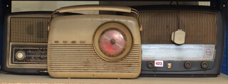 A Phillips MK4009 radio in brown Bakelite case, a Bush Type VHF70 radio in brown Bakelite case and a Bush Type TR82B portable radio 