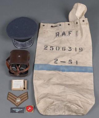 An RAF cloth kit bag, a pair of field glasses marked Busch prisma-binocle and a set of naval silhouette cards, peaked cap etc