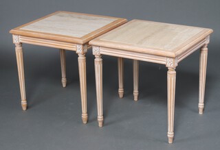 A pair of square limed oak finished lamp tables with white veined marble tops, raised on turned and fluted supports 61cm x 59cm  