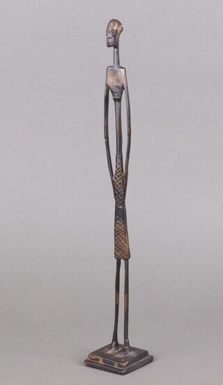 A mid-century metal figure of a standing lady 43cm 