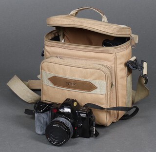 A Minolta Dynax 7000I digital camera with a 52 Sigma Super-Wide 2 lens and flash unit, contained in a cloth bag 