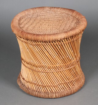 A circular woven cane stool of waisted form 42cm h 