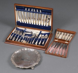 A silver plated salver with bracketed border 29cm, a set of 6 silver plated Kings pattern fish knives and forks cased and a canteen of cutlery in a walnut box  