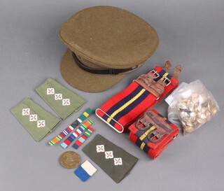 An Army dress service cap, 2 Royal Artillery stable belts and various buttons 