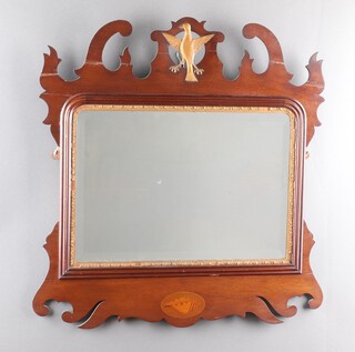 A 19th Century arched bevelled plate mirror contained in an inlaid mahogany frame surmounted by an eagle 71cm x 66cm (a/f)