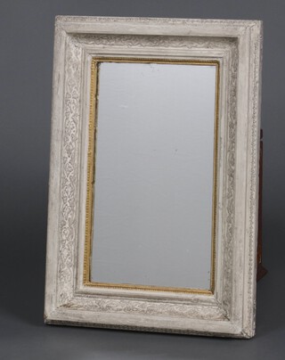 A rectangular plate mirror contained in a 19th Century carved white painted frame 48cm x 33cm 