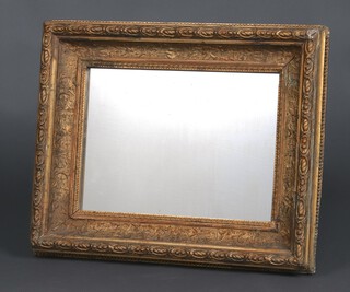 A rectangular plate mirror contained in a 19th Century gilt plaster painted frame 56cm x 46cm 