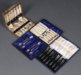 A set of 6 1930's bean end coffee spoons, a set of 6 silver plated cake knives and forks, 6 silver plated fruit spoons and forks, 6 ditto tea spoons, all cased 