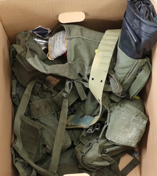 A quantity of military webbing including mess tins, ground sheet, water bottle, etc