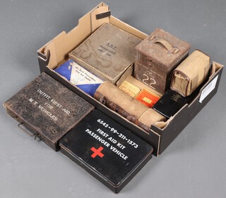 An first aid tin for a MT Vehicle, a passenger vehicle ditto, a cardboard ARP first aid box and other first aid tins and boxes 