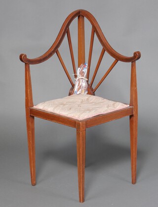 An Edwardian inlaid mahogany corner chair with sun burst back and upholstered seat, raised on square tapered supports 87cm h x 53cm w x 46cm d (slat back a/f)
