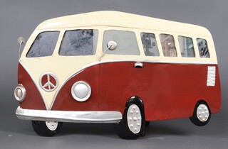 A red and white pressed metal wall plaque in the form of a VW Camper Van with mirrored windscreen 48cm x 58cm  