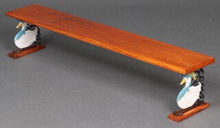 A rectangular pine shelf raised on painted iron duck shaped supports 17cm x 90cm x 15cm 