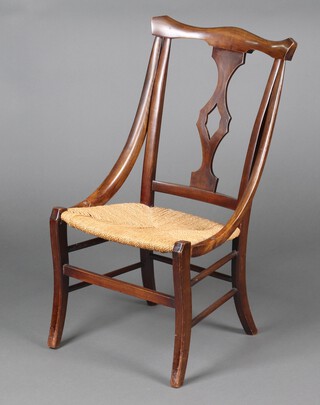 An Art Nouveau beech framed bar back nursing chair with woven rush seat 82cm h x 44cm w x 40cm d 