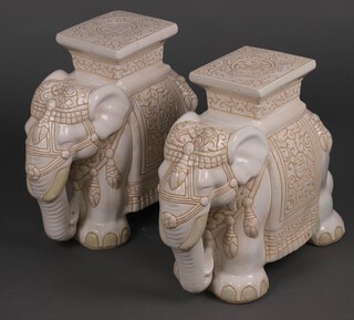 A pair of pottery garden seats in the form of elephants 46cm 