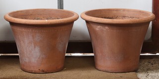 A pair of circular terracotta garden planters 31cm h x 43cm diam.