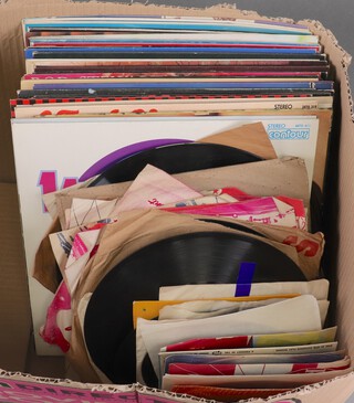 A quantity of 1970/80's 45rpm and 33rpm vinyl record albums and singles to include Bill Hayley, T-Rex, Don Maclean "American Pie", Abba, Little Richard, Rod Stewart and others 