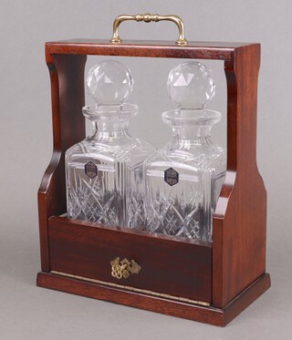 A mahogany 2 bottle tantalus with 2 Stuart Glass spirit decanters 31cm h x 27cm w 