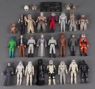 A collection of 24 Star Wars figures including Han Solo, Chewbacca, Storm Troopers etc 