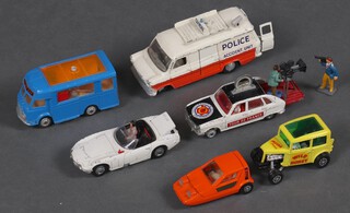 A collection of play worn Dinky and Corgi toys to include Whiz-Wheels Bond Bug 700, James Bond Toyota 2000GT, Corgi Smiths Carrier Joe's Diner van, Tour de France Renault 16 with cameramen and Ison Brothers Racing Whiz-Wheels drag racer 