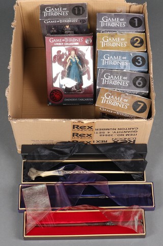 Seven Funko Game of Thrones figures nos. 1, 2, 3, 6, 7, 11 and 12, all boxed together with 3 Harry Potter magic wands 